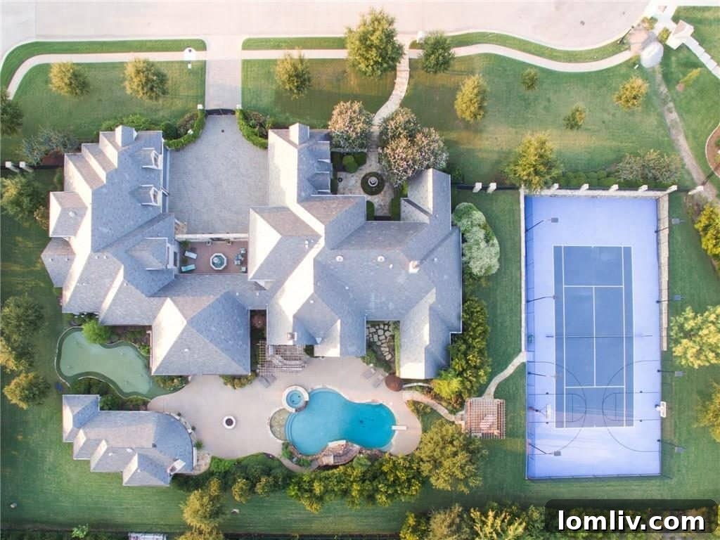 Expansive swimming pool and meticulously landscaped grounds of 4649 Saint Laurent Court.