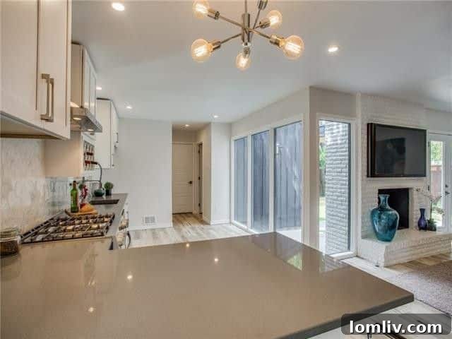 Broken Bow Beauty: The Premier Destination for Holiday Roasts 8 Bright and airy kitchen with pristine white cabinetry, a large wooden island, and sleek modern fixtures, perfect for cooking and entertaining