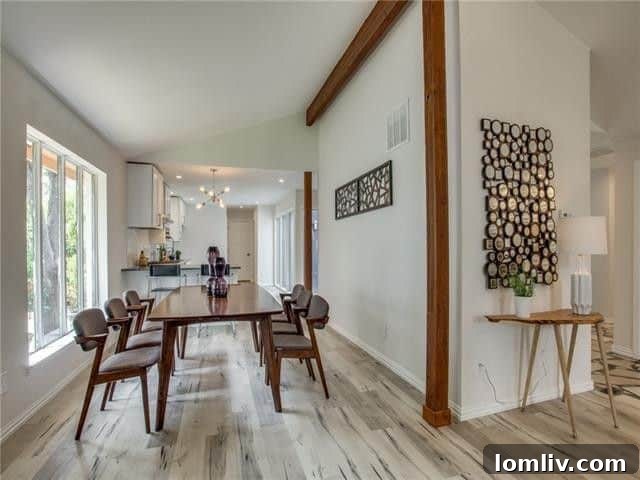 Broken Bow Beauty: The Premier Destination for Holiday Roasts 9 Elegant dining table set for a formal meal, showcasing the spaciousness of the open-concept living area at 9797 Broken Bow Road