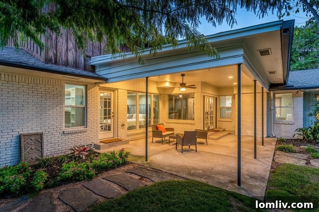 Expansive Rear View of 11031 Lawnhaven's Backyard and Lush Green Space