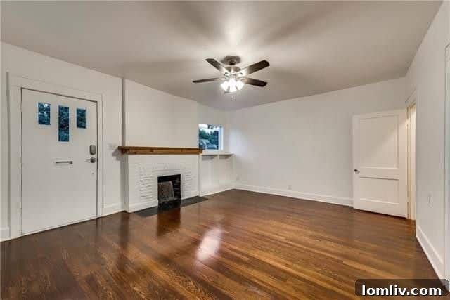 Living room with original hardwood floors in a Dallas Tudor