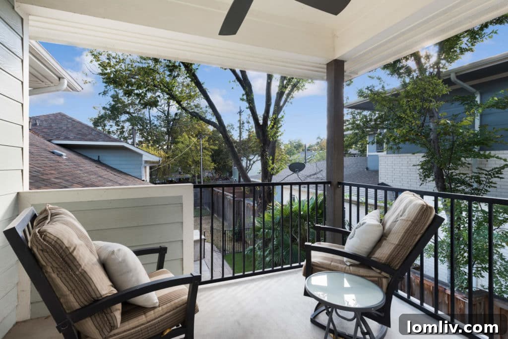 Spacious master bedroom with modern decor and a private balcony