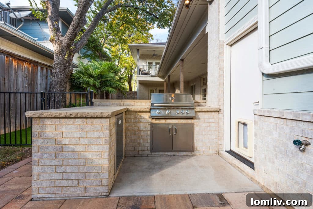 Outdoor kitchen area with doggie door leading to a pet care area in the garage