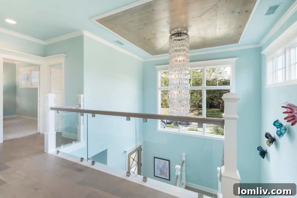 Two-story foyer featuring a stunning glass chain chandelier