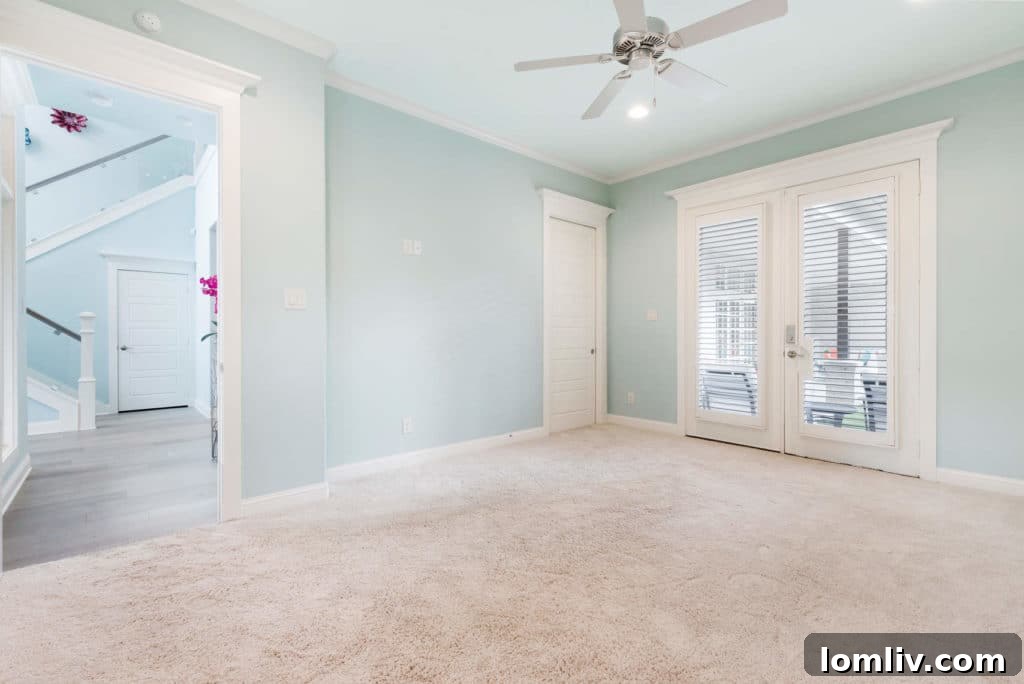First-floor bedroom with direct access to a back porch, ideal for a home office