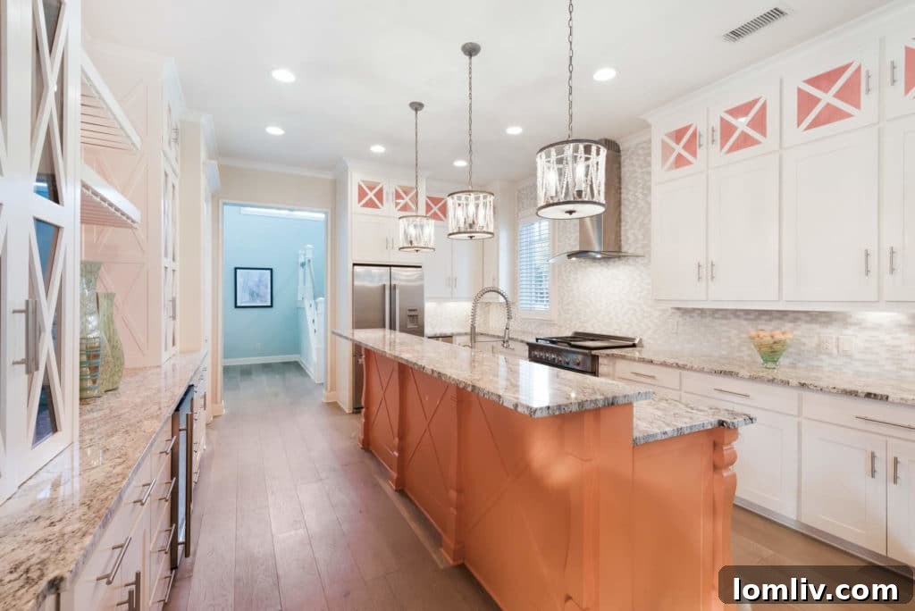 Gourmet kitchen with Hermès orange island and floating shelves