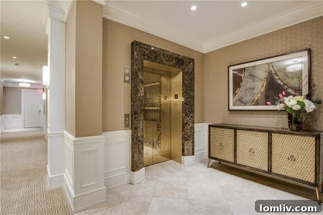 Luxurious master bathroom with Calacatta marble, dual vanities, and a large soaking tub