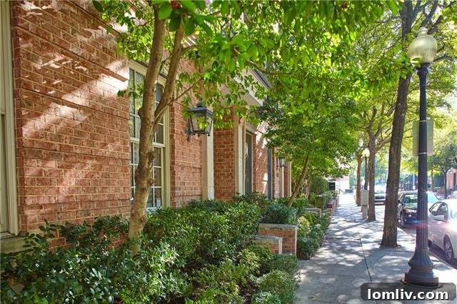 Bright and spacious open-concept living area with hardwood floors and ample natural light