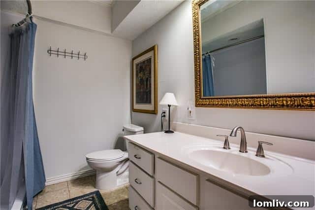 The second spacious and updated bathroom in Unit 204, reflecting modern design.