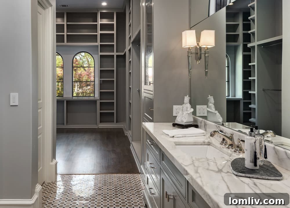 Spa-like master bathroom with dual vanities and elegant finishes