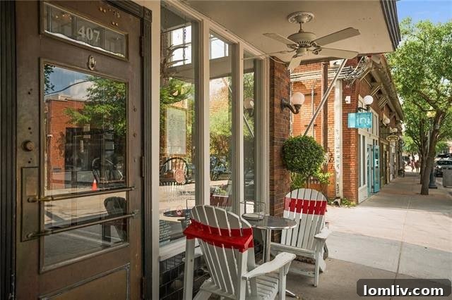 The rear exterior of the Elsbeth Street Craftsman, showcasing a spacious deck with Dallas skyline views.