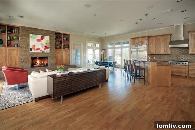 An inviting outdoor living space with a fireplace, perfect for entertaining at the Kensington Lane luxury home.