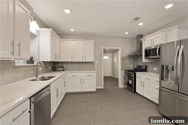 Interior view of the updated Craftsman home, showcasing hand-scraped hardwood floors and a bright, inviting atmosphere.