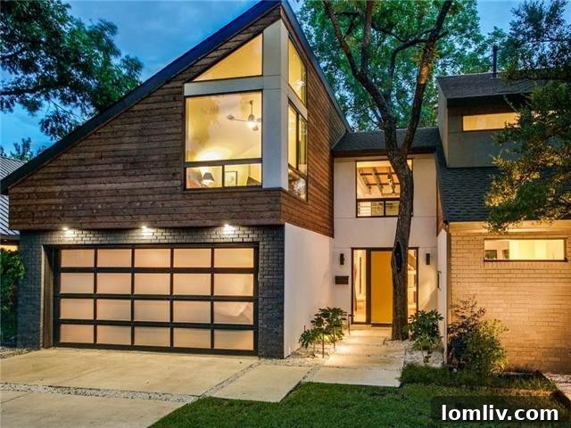 Striking modern home exterior with large windows overlooking a lush landscape and serene creek.