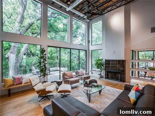Modern entryway with an open-tread staircase and abundant natural light.