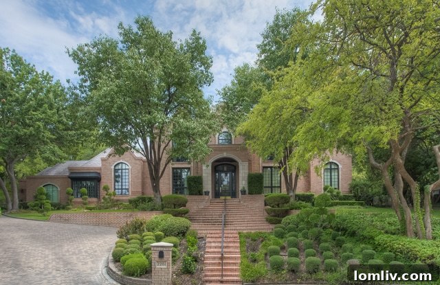 2201 Hidden Creek Road in Westover Hills, a luxurious home nestled among trees for ultimate privacy.