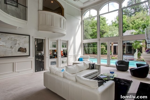 Tall windows in 2201 Hidden Creek Road requiring no coverings due to exceptional privacy.