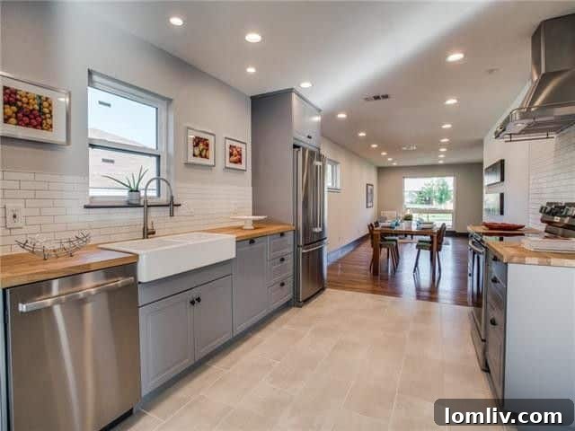 Detailed view of the modern kitchen backsplash and open shelving with carefully selected decor