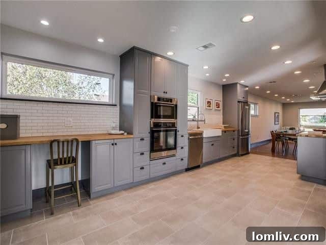 Close-up of the stylish butcher block countertops and integrated appliances in the updated kitchen