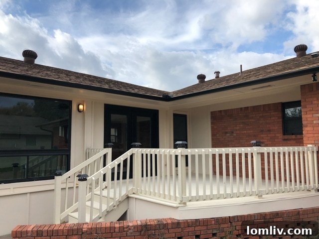 Spacious newly painted deck off the sunroom, perfect for outdoor entertaining and enjoying the backyard views