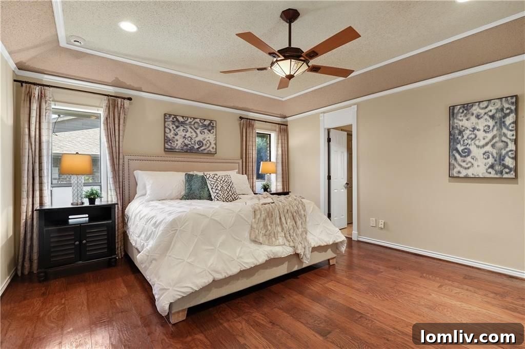 Cozy and inviting bedroom with abundant natural light, offering a peaceful retreat