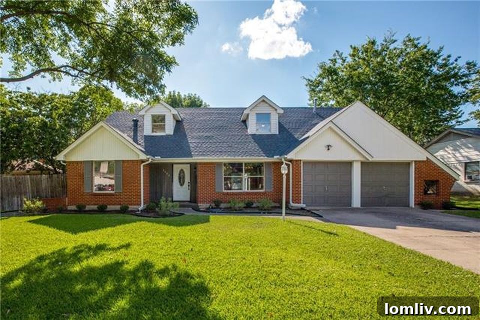 Renovated red-brick traditional home exterior in Farmers Branch, featuring updated landscaping