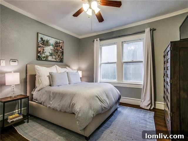 Spacious master bedroom with ample natural light and elegant decor.