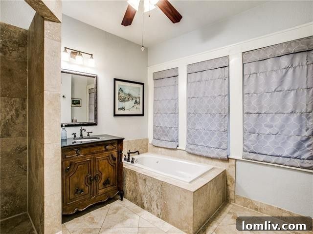 Separate glass-enclosed shower in the master en-suite bathroom.