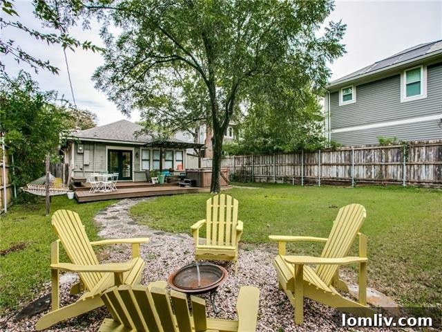 Spacious backyard with a large Trex composite deck, perfect for outdoor entertaining.