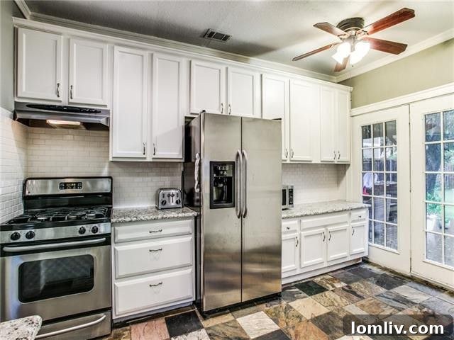 Close-up of the stylish subway tile backsplash and modern kitchen fixtures.