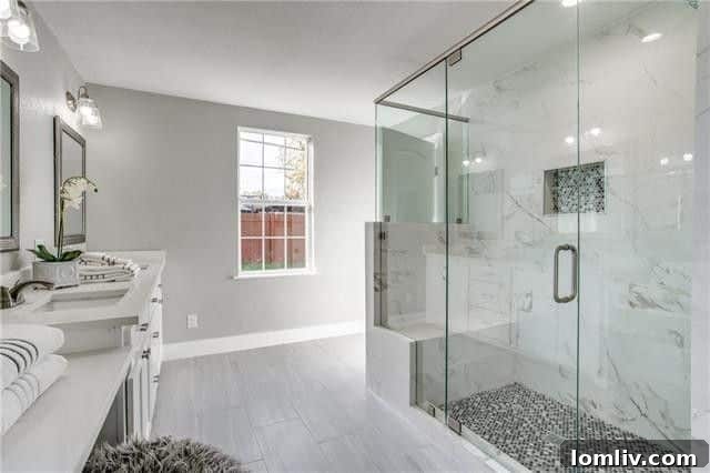 Stylish shower with contemporary tilework and glass enclosure
