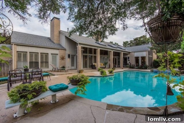 Stunning backyard oasis with covered patio, swimming pool, and hot tub