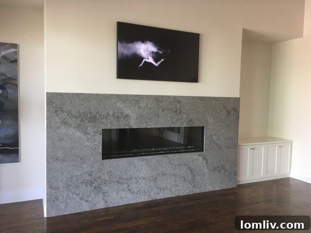 Sleek, modern white fireplace without a mantel at 1105 Knoll Crest