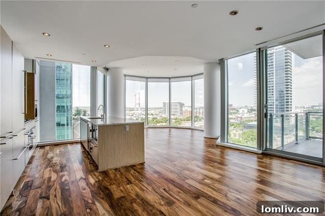Elegant living area of the Azure condo with floor-to-ceiling windows and stunning city views.