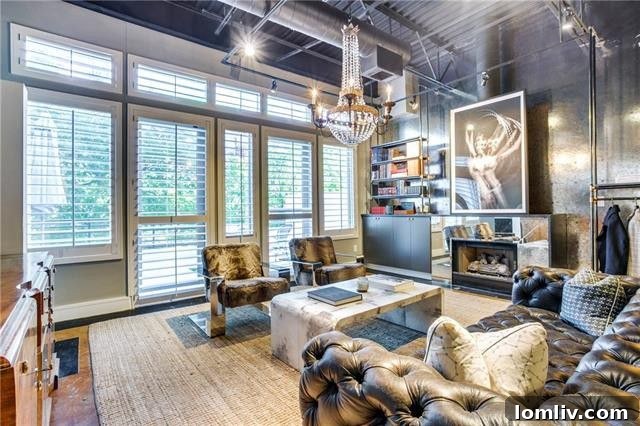 Another view of the sophisticated primary bedroom in the urban loft.