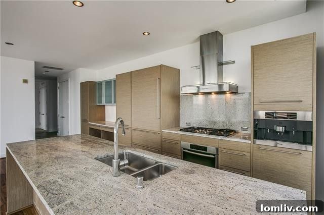 Detailed view of the gourmet kitchen appliances, including SubZero and Miele.