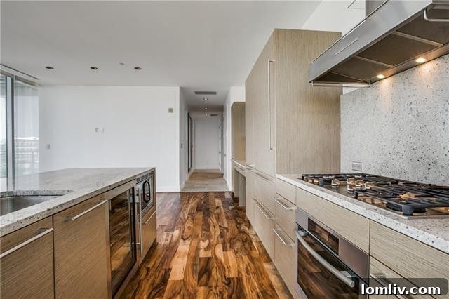 Built-in espresso maker and wine fridge in the Azure condo's kitchen, perfect for entertaining.