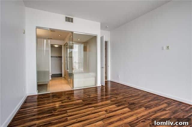 Luxurious primary bathroom with modern fixtures and spacious design in Azure.