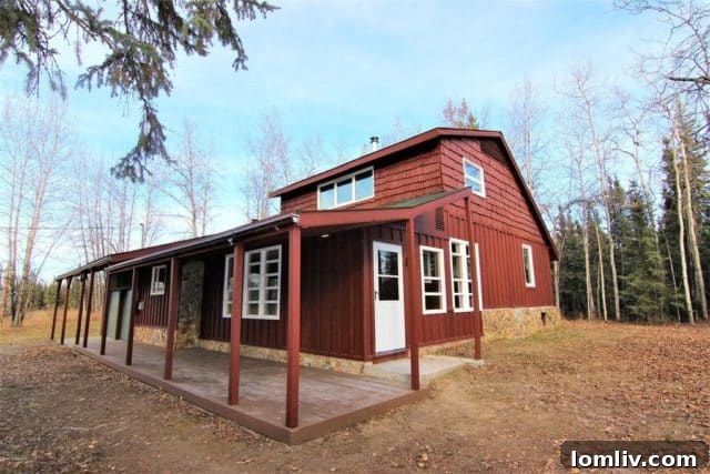 A charming Midcentury cabin nestled among snow-covered trees in North Pole, Alaska