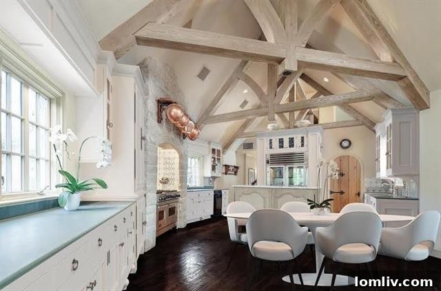 Provencal Farm Style Kitchen with Timber Beams and Stone Niche