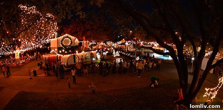 Families and children enjoying the festive atmosphere and lights at Santa's Village in Richardson, Texas