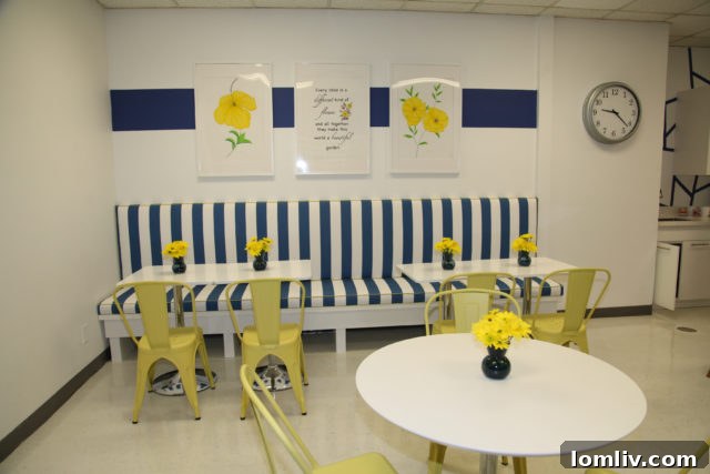A view of the refreshed Merriman Park Elementary teachers' lounge, showcasing new seating arrangements and improved lighting.