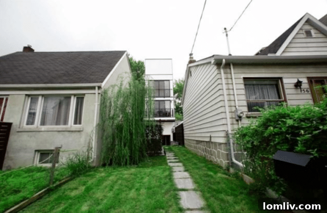 Exterior view of the four-story Toronto skinny house on a narrow lot