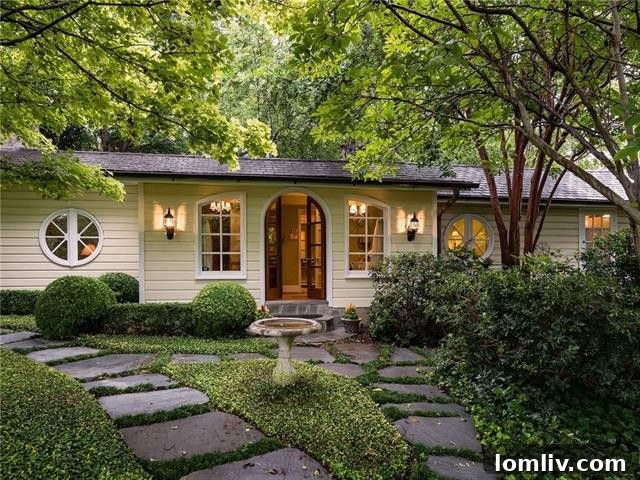 Elegant Bluffview estate home adorned with elaborate Christmas lights and decorations.