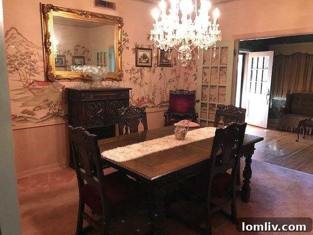 Elegant 1950s dining room with vintage wallpaper and chandelier