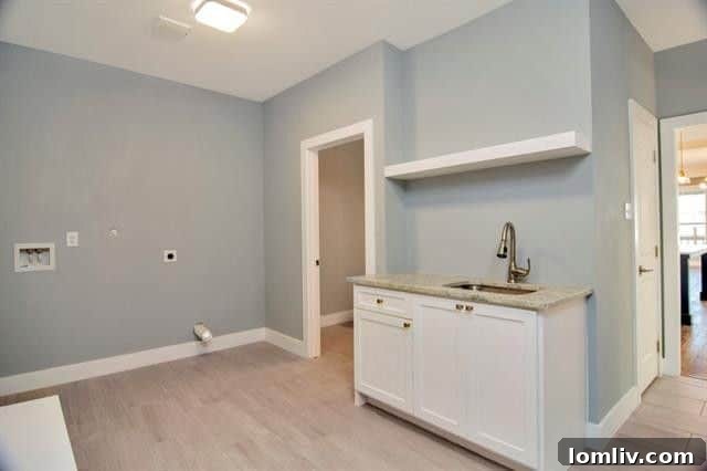 Another view of the versatile laundry and mudroom area, showcasing its practical design and integrated storage solutions