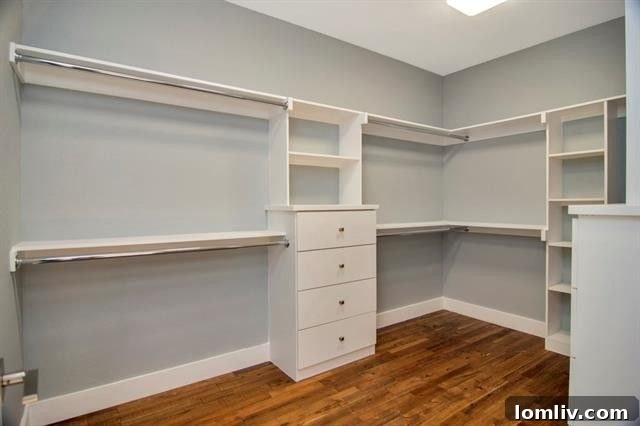 Spacious master closet with custom-designed shelving and ample storage solutions, reflecting the home's commitment to organized luxury
