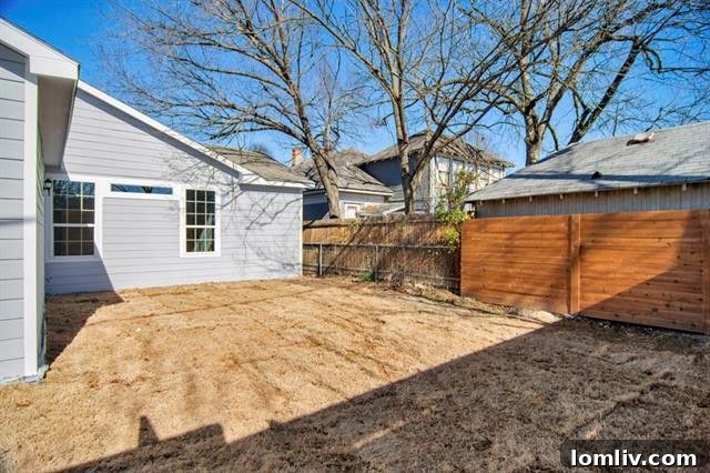 Secure and private fenced backyard, offering ample space for outdoor activities, relaxation, and entertaining in Bishop Arts