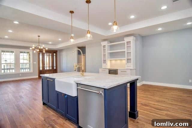 Modern stainless steel gas range with a sleek hood, set against a stylish tile backsplash, making cooking a delight in this renovated kitchen