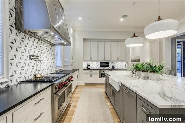 Another view of the spacious kitchen with a large island, ideal for entertaining at 3414 Beverly Drive